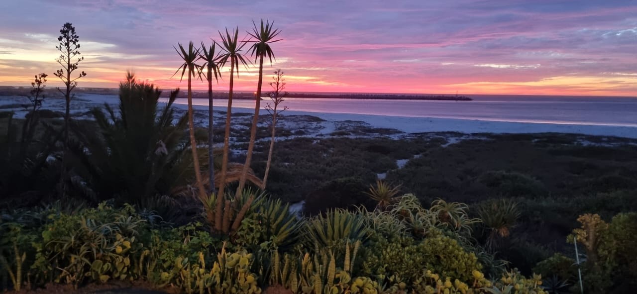 Sunset over the rugged West Coast shoreline