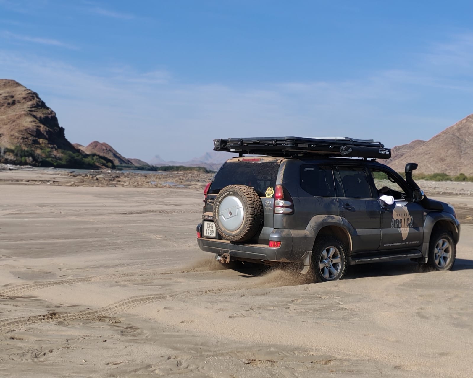 Why Not Africa Tours 4x4 travelling through a remote sandy mountain route