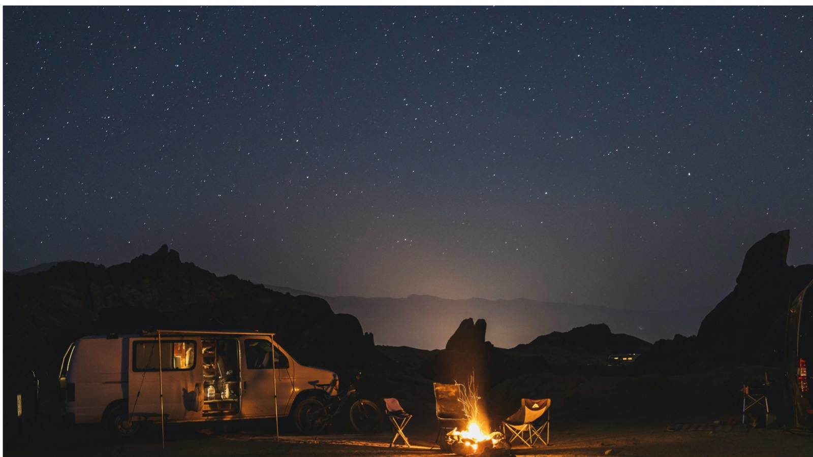 Campfire beneath the night sky on the Namibia Discovery camping tour
